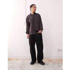 Reclaimed Vintage – Svarta manchesterjeans med baggy passform-Svart/a