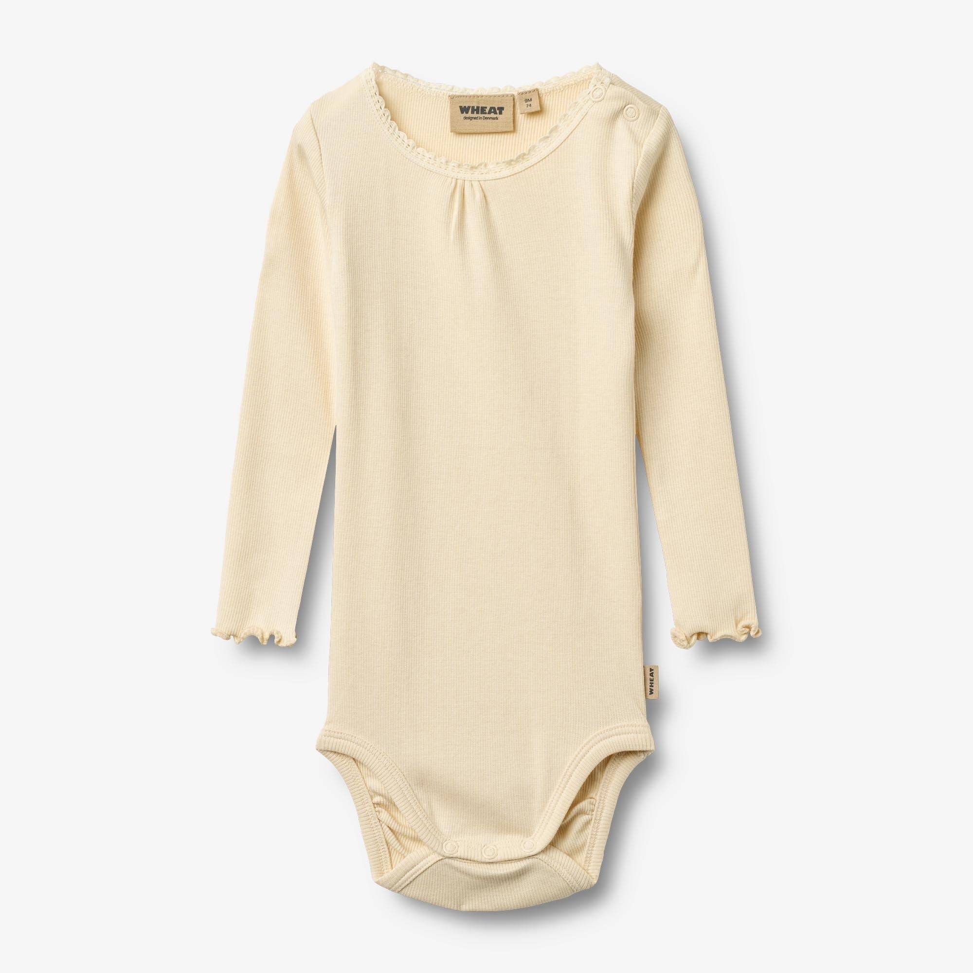 WHEAT® - Langærmet Blonde Rib Body Lotta - barely apricot - Str 50.