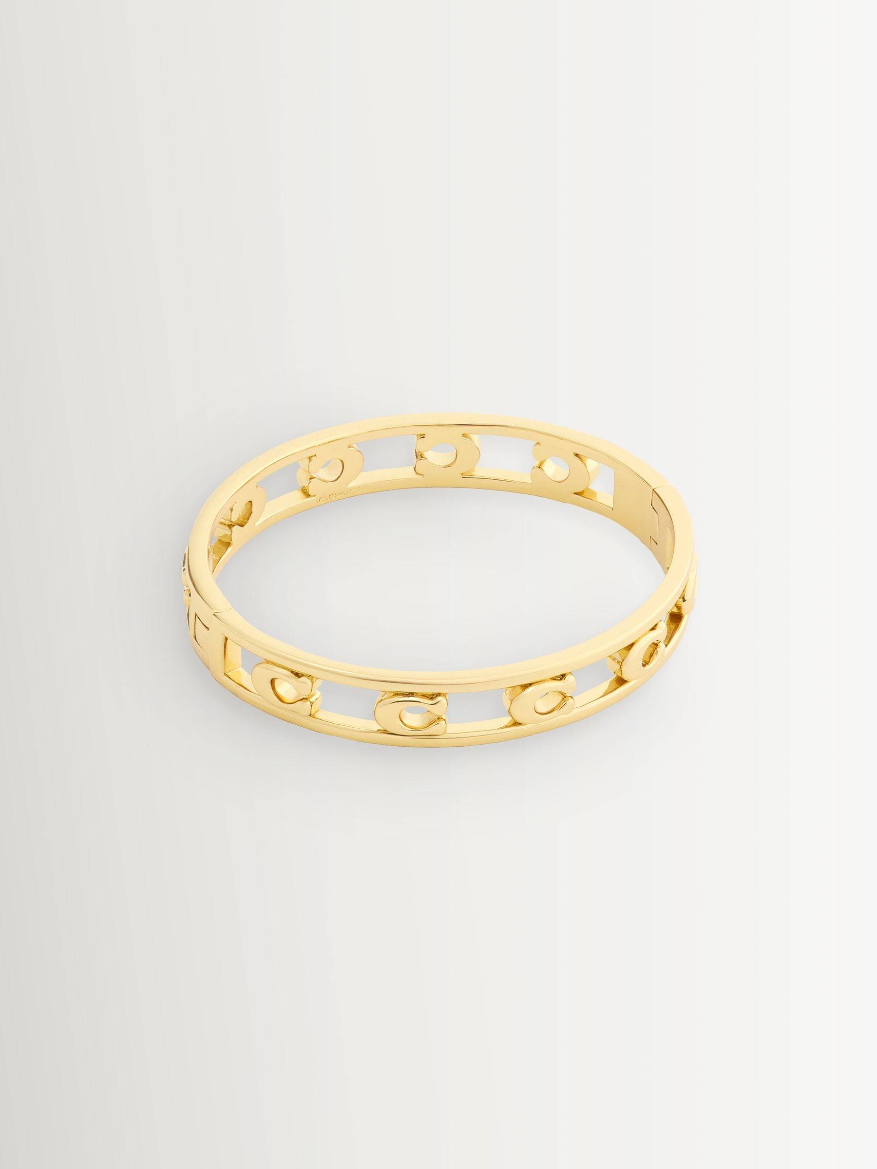 Coach COACH Gold Tone Signature C Openwork Bangle Bracelet