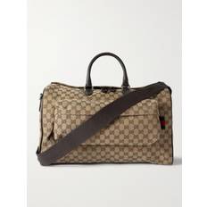 Gucci - Leather-Trimmed Monogrammed Coated-Canvas Duffle Bag - Men - Neutrals