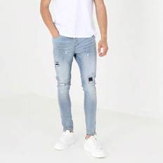 Skinny fit-jeans med revor och lagningslappar - Ljusblå (36L,32R,30R,28L,30L,36R,34R,34L,28R,32L)
