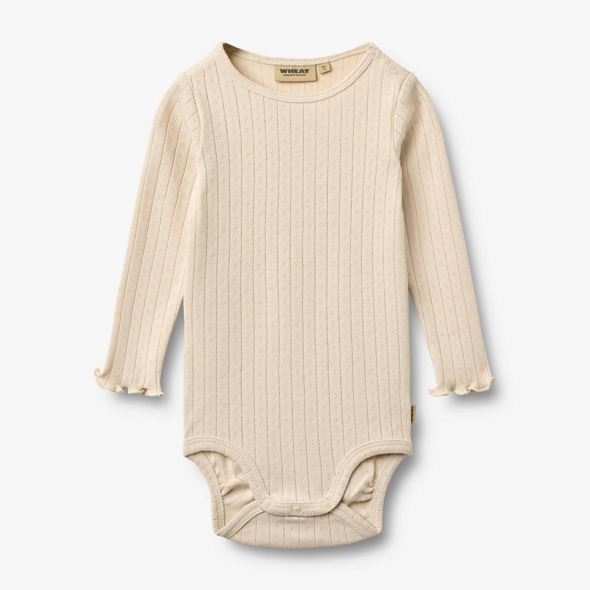 WHEAT® - Langærmet Body Rie - almond peach - Str 62.