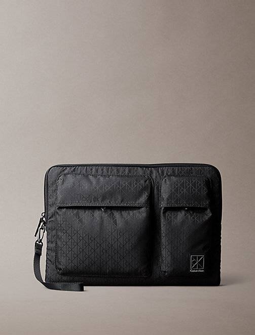 Calvin Klein  Allover Emblem Logo Jacquard Laptop Sleeve