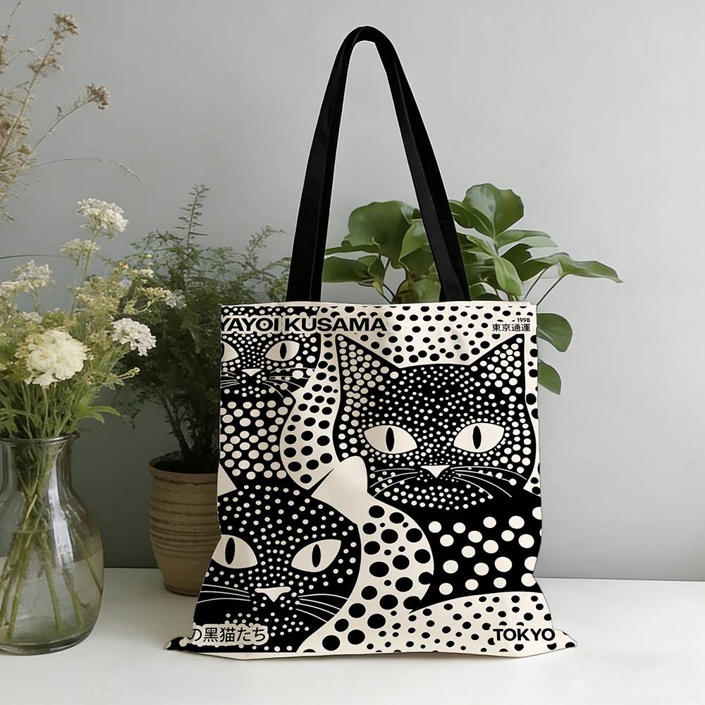 1pc Polka Dot Black Cat Tote Bag Features bold polka dot patterns and cute cat motifs in a Japanese artistic print design. Made