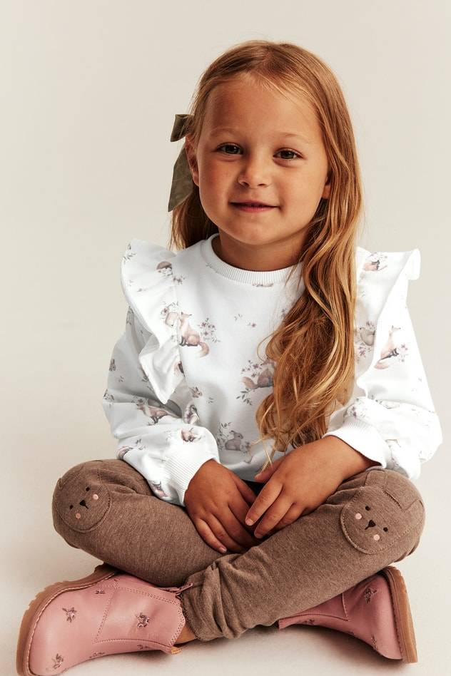 Mönstrad sweatshirt med volanger