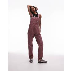 Carhartt WIP – Gammelrosa hängselbyxor
