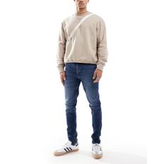 ASOS DESIGN - Skinny-jeans i mørk vintagevask-Blå