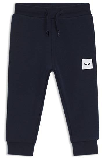 Kids' fleece tracksuit bottoms with logo label