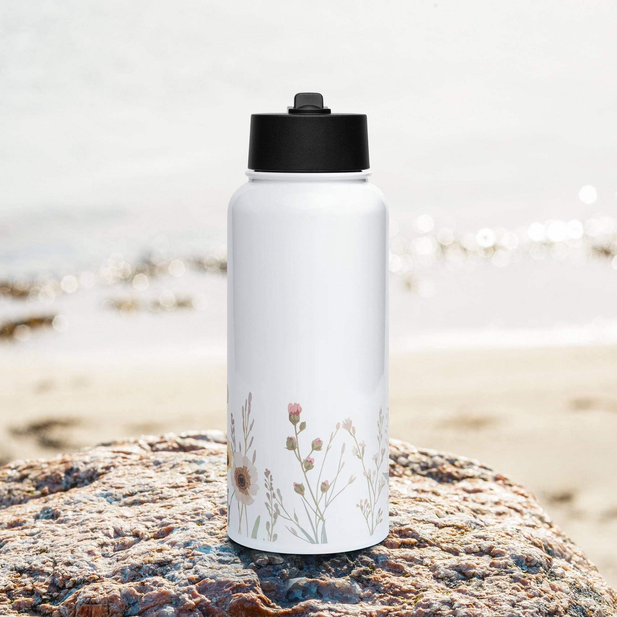 Stainless steel water bottle with a straw lid