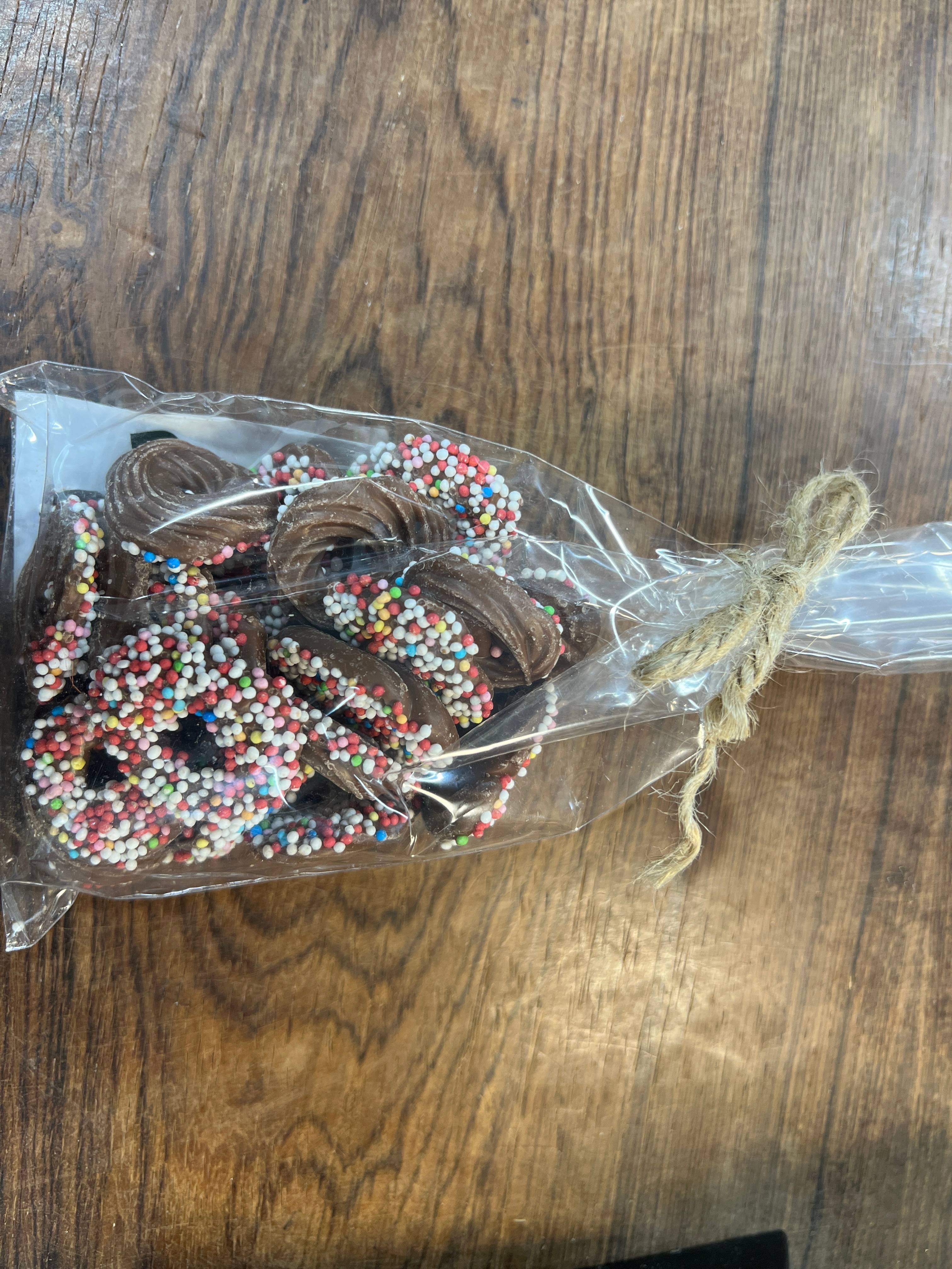 Chokolenten, Harlekin ringe, lys chokolade med tivolikrymmel, ca. 100 g
