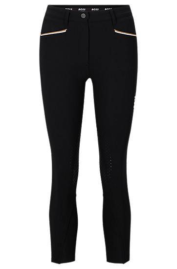 Equestrian knee-grip breeches in power-stretch material