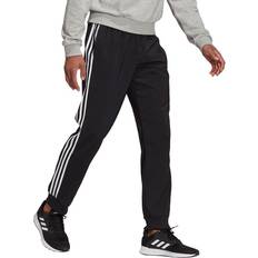 Adidas essentials 3 stripes tapered pants adidas Aeroready Essential Tapered Cuff Woven 3 Stripes Pants - Black