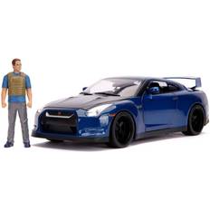 Giocattoli Veicoli Jada 2009 Nissan GT-R (R35) Blue Metallic and Carbon with Lights and Brian Figurine 'Fast & Furious' Movie 1/18 Diecast Model Car