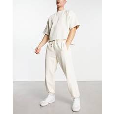 New Balance Men's NB Athletics Nature State Sweatpant in Beige Cotton