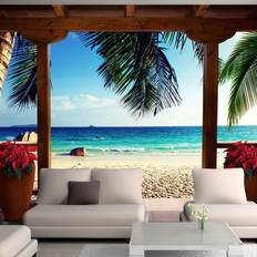 Tapeter Artgeist Fototapet med motiv af feriehus med terrasse ved strand med palmer flere størrelser 300x210