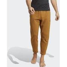 Bronce Pantalones & Shorts Adidas Pantalones de Yoga Training Hombre - Vara de Oro Oscura