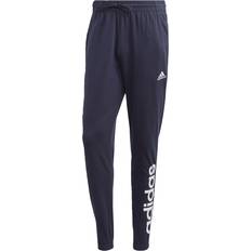 Adidas Linen Trousers & Shorts adidas Essentials Single Jersey Tapered Elasticized Cuff Logo Pants - Legend Ink