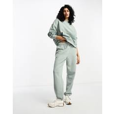 New Balance Vrouw Broeken New Balance Fleece Sweatpant - Groente/Poly Fleece