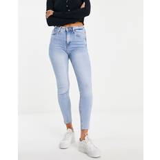 River Island – Mellanblå skinny jeans med råskuren fåll och hög midja