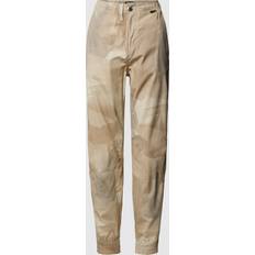 Beige - Unisex Hosen G-Star Jogpants mit Allover-Muster Modell 'Trainer' in Sand, Größe