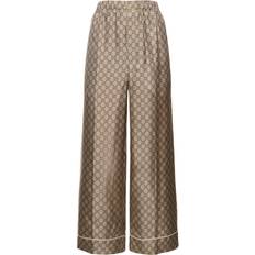 Gucci Byxor Gucci GG Supreme wide-leg silk pants brown