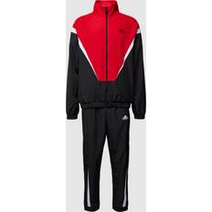 Damen - Lang Jumpsuits & Overalls adidas SPORTSWEAR Sweatanzug mit Label-Details in Black, Größe