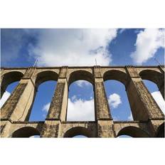 Blue Posters BrainBoosters Low Angle of A Stone Arched Viaduct with Sky Poster