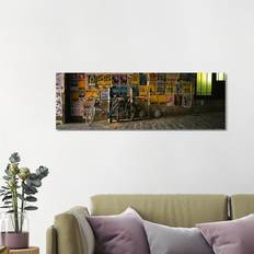 Ebern Designs Bicycle Leaning Against a an Alley, Post Alley Framed Art