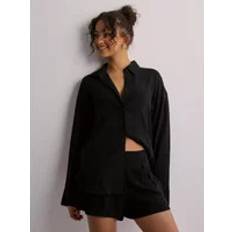 Nelly Byxor & Shorts Nelly Linneshorts Svart Flowy Linen Shorts Shorts