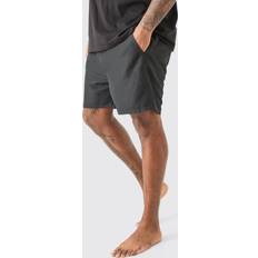 Musta - Yksivärinen Uimahousut boohooMAN Plus Plain Mid Length Swim Short - Black