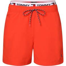 Tommy Hilfiger Men Swimwear Tommy Hilfiger Repeat Logo Mid Length Swim Shorts DARING SCARLET