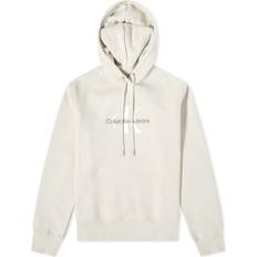 Calvin Klein Hoodies - Women Sweaters Calvin Klein Women's Archival Monologo Hoodie in Eggshell