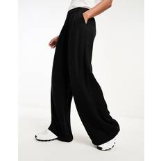 ASOS DESIGN – Hose in Schwarz mit weitem und glatter Vorderseite