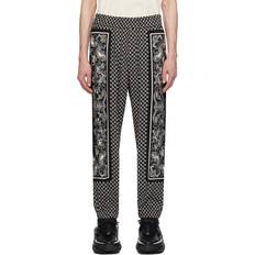 Balmain Herr Byxor Balmain Avslappnade Byxor med Mini Monogramtryck - Svart