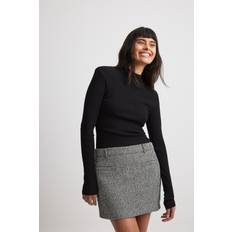 NA-KD Mininederdel sort og hvid tweed-Black