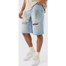 Shorts boohooMAN Mens Ripped Dirty Wash Denim Jorts In Light Blue