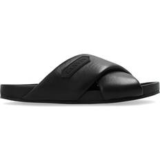 Lanvin Slippers & Sandals Lanvin logo-appliqué crossover leather slides women Lamb Skin/Rubber/Lamb Skin Black