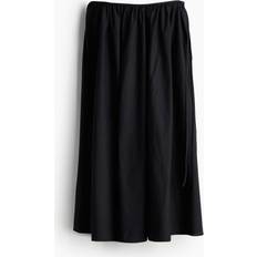 H&M Svart Cirkelskuren kjol med knytband