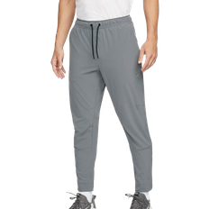 Hombre - Yoga Pantalones & Shorts Nike Unlimited Versatile Dri Fit Pants With Zip Cuffs Men - Smoke Grey/Black