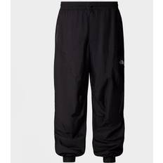 Man - White Trousers & Shorts The North Face NSE x Yinka Ilori Wind Shell Trousers, Black