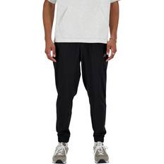 New Balance Byxor New Balance Sport Essentials Woven Jogger - Svart