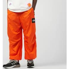 The North Face Unisex Hosen The North Face Tnf X Yinka Ilori Windshell Trousers - Red Orange