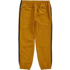 Supreme Men Trousers & Shorts Supreme LACOSTE Track Pant - Gold