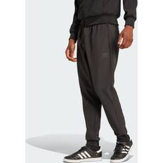 Vêtements Adidas Bonded Sst Track Herren Hosen Black