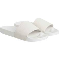 Calvin Klein Slides Calvin Klein Präglad Logga Slide Polyester Beige