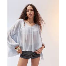 Clothing ASOS DESIGN v neck volume peplum blouse in blue