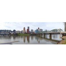 Posters Bridge Across A River With City Skyline 18 x 6 Poster