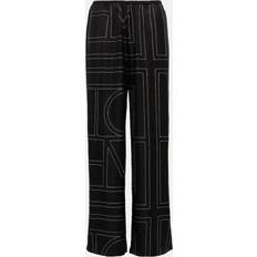 Toteme Byxor Toteme Logo Wide-Leg Silk Pants - Black