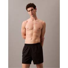 Calvin Klein Swimming Trunks Calvin Klein Logo Badge Solid Swim Shorts - Black