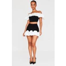 Velvet Skirts PrettyLittleThing Petite Black Velvet Ruffle Detail Mini Skirt - Black